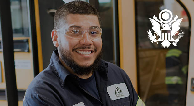 Veteran school bus driver with a welcoming smile