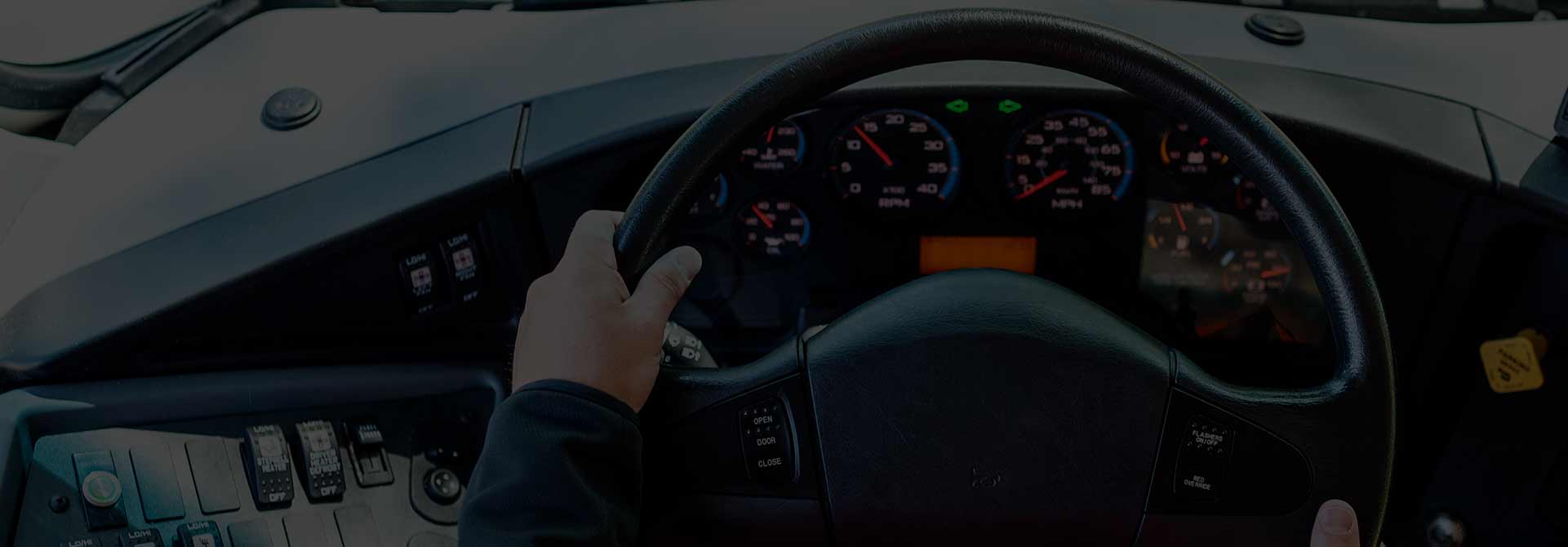 A first person perspective of a bus steering wheel