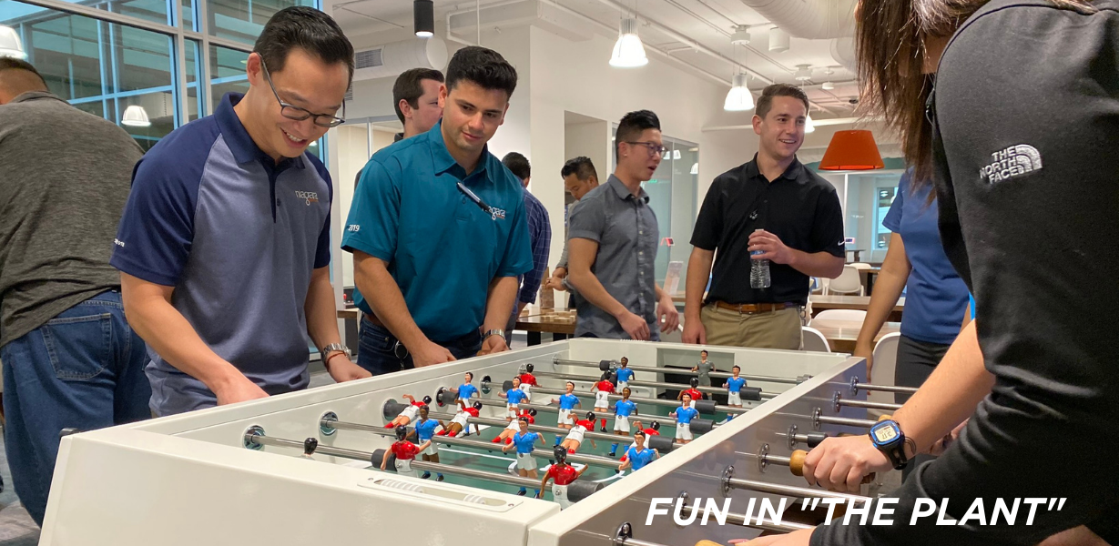 Niagara team members playing foosball at HQ 