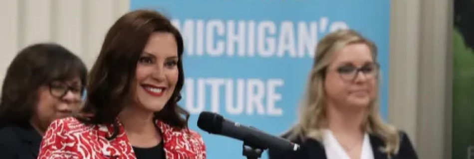 Woman smiling in front of a microphone