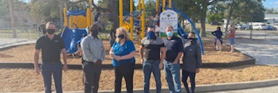 Niagara team members standing in front of a playground