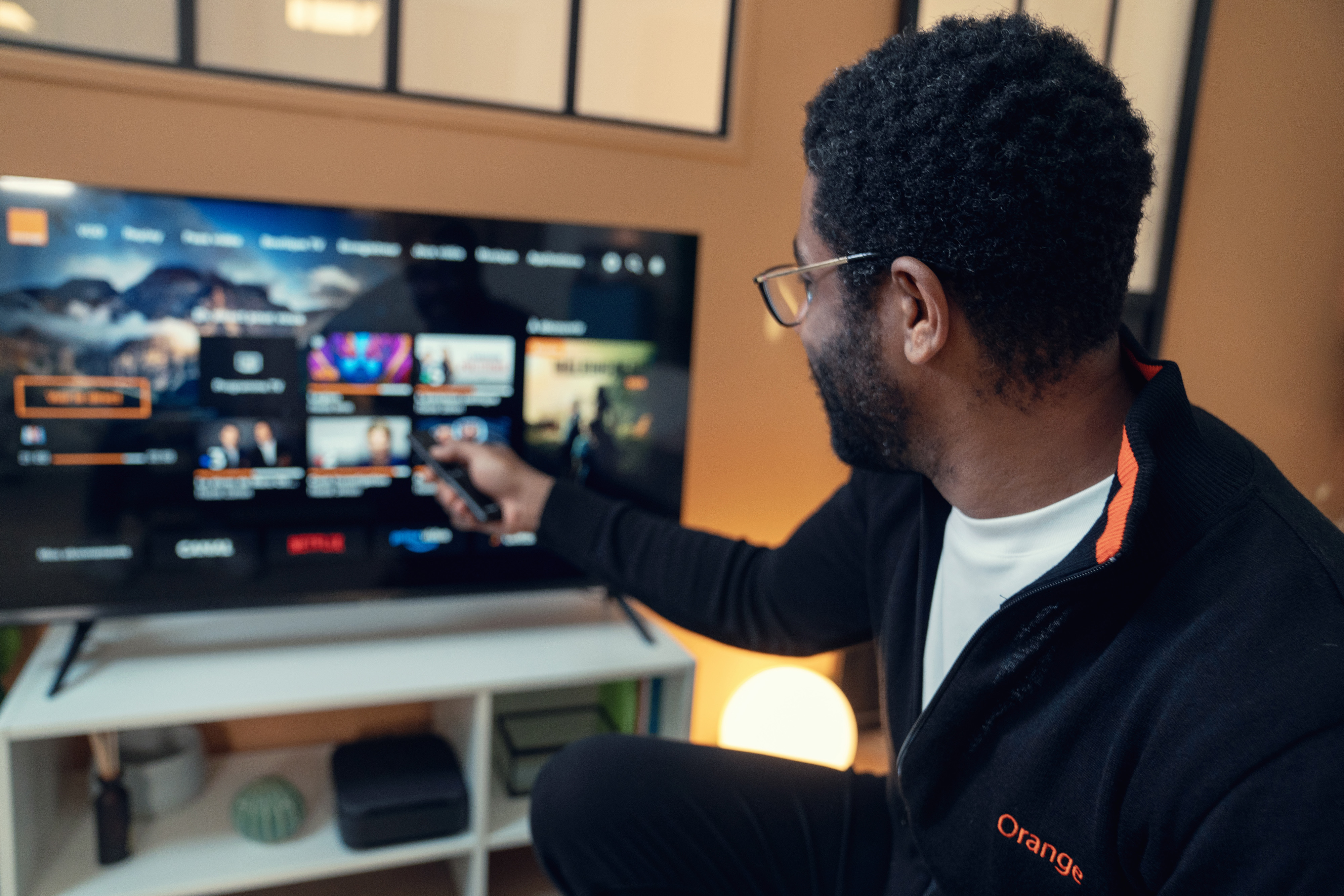 An Orange technician carries out the internet installation at a customer’s place.