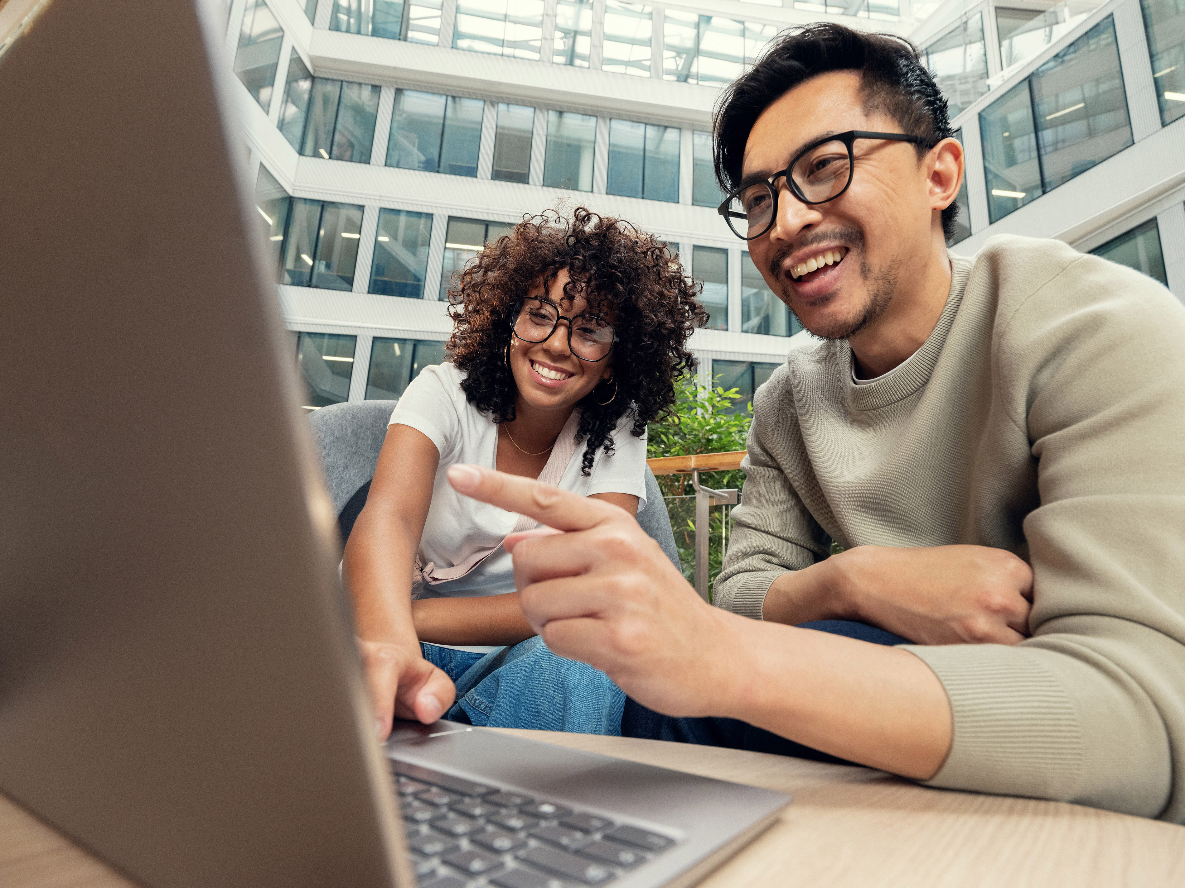 Two Orange colleagues enjoy a fun moment in the company’s break room.