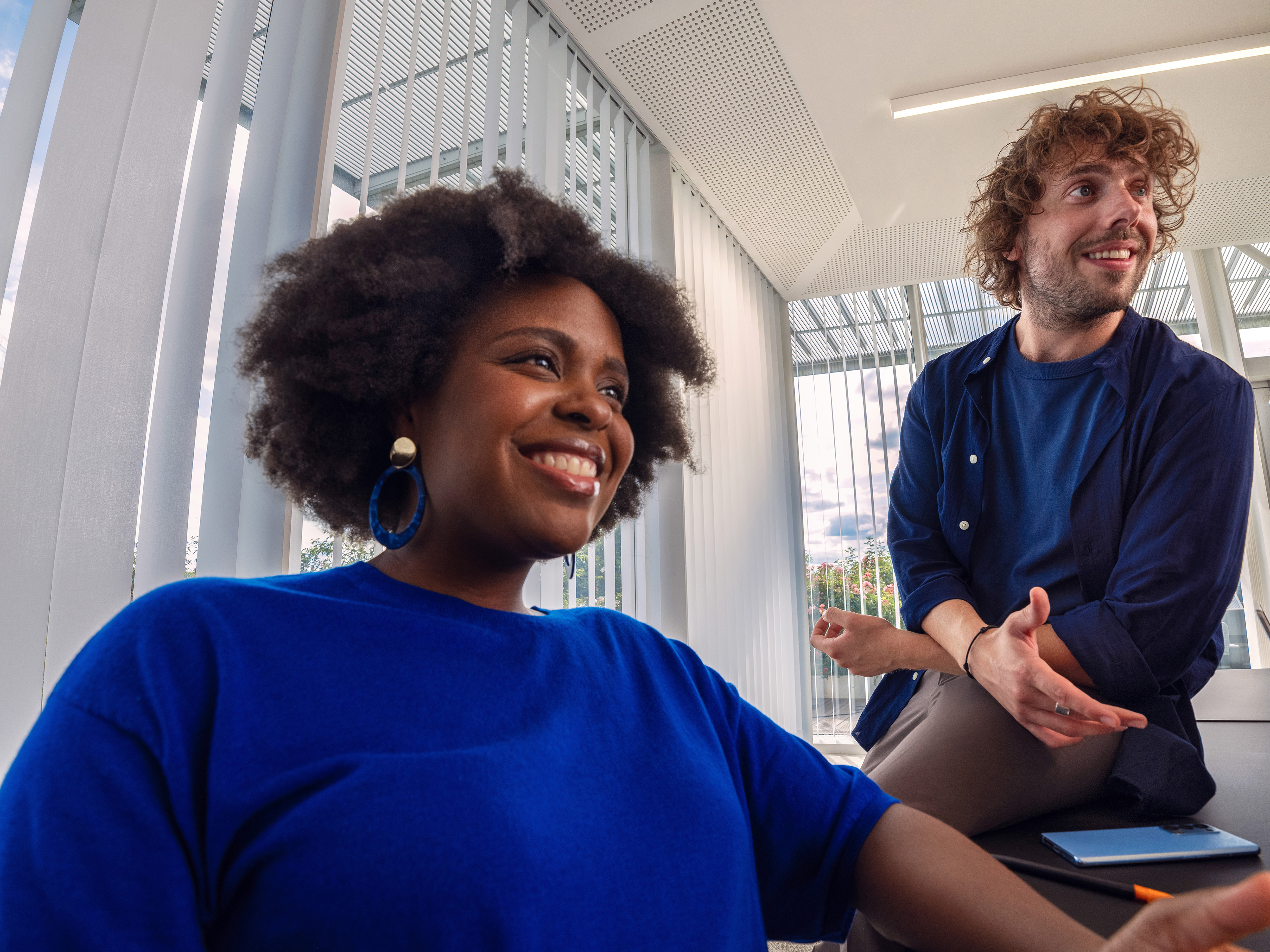 Orange colleagues having a good time at a meeting