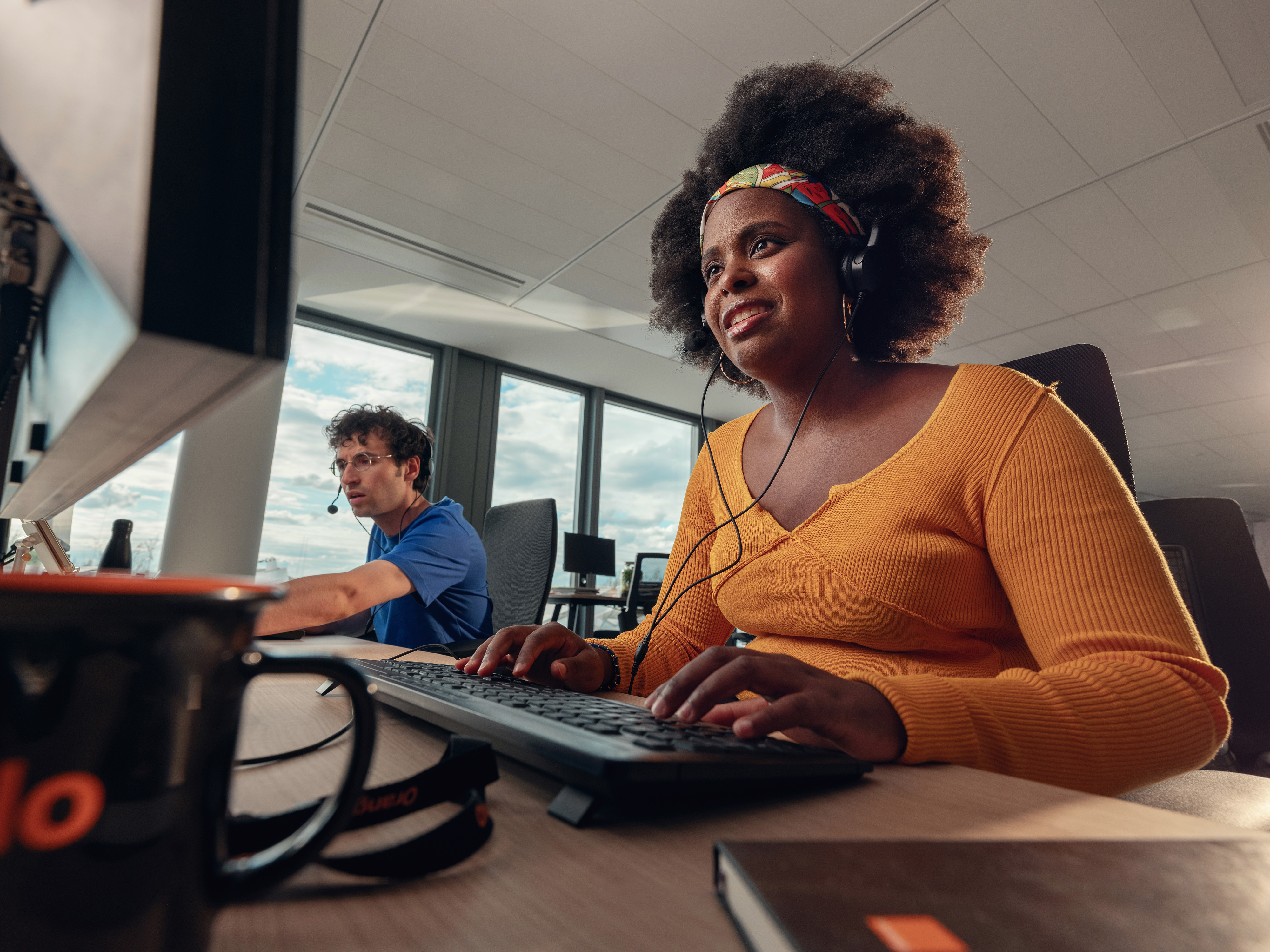 An Orange employee in a video conference