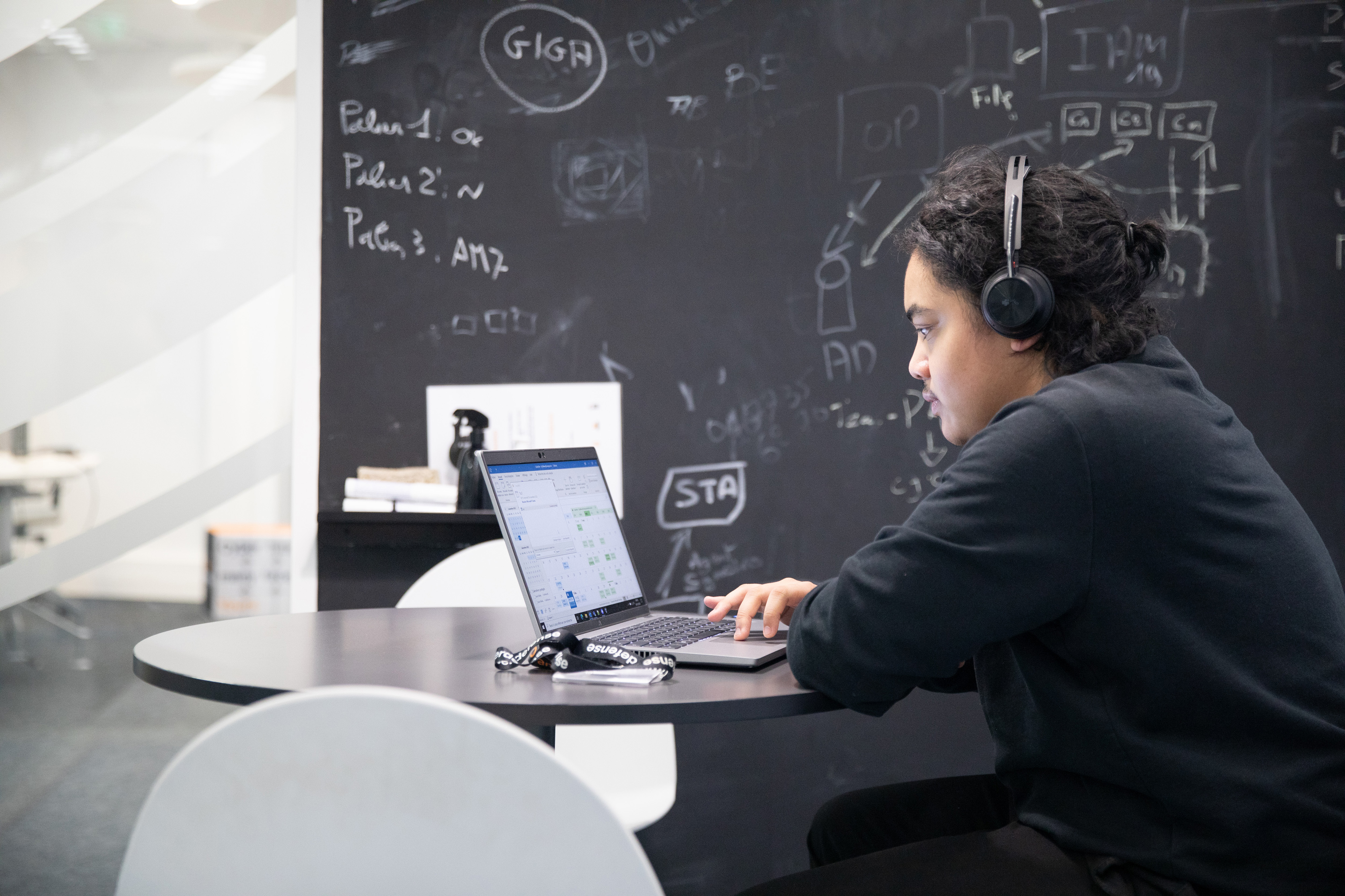 An Orange employee participating in a remote meeting