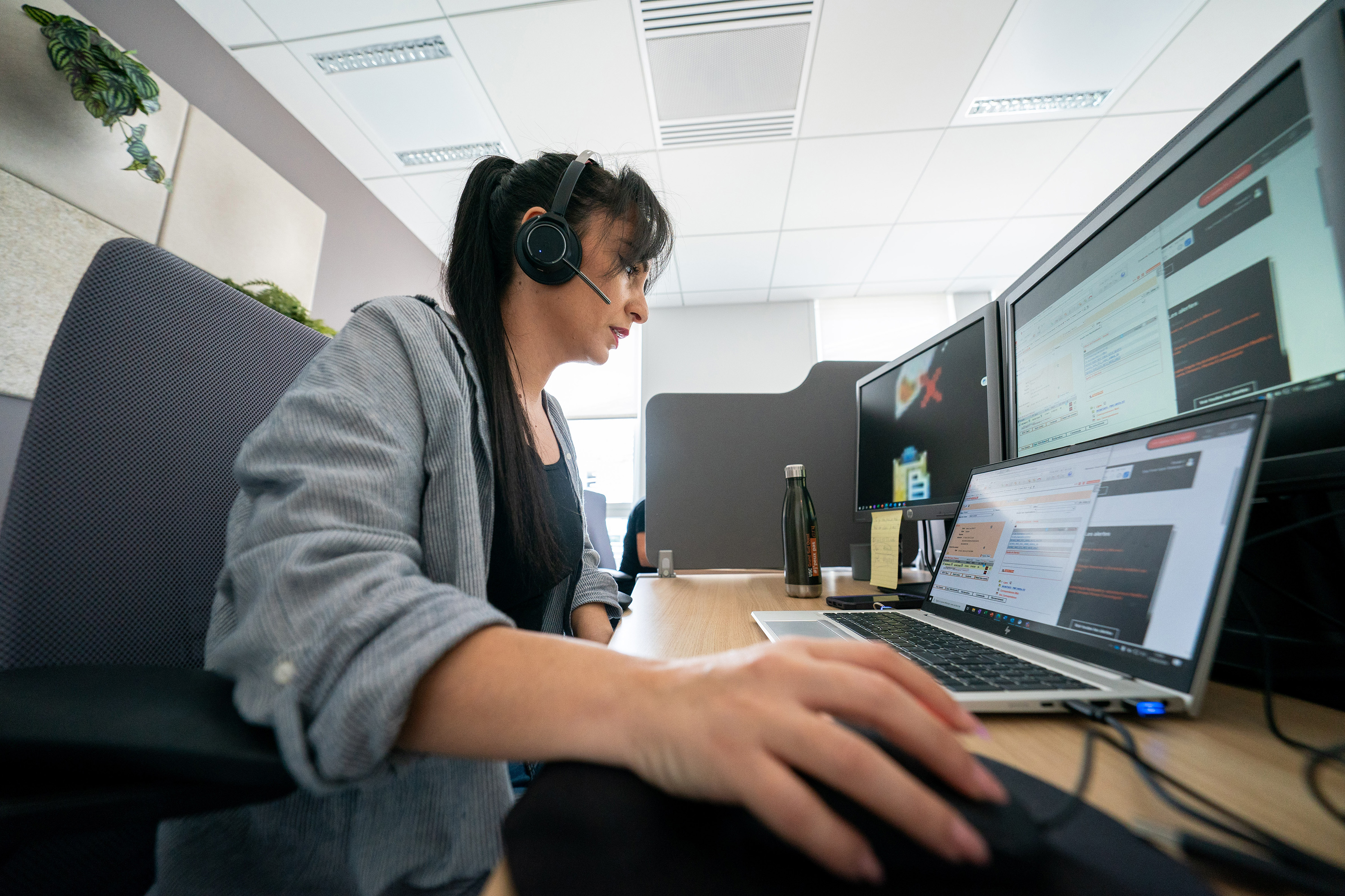 Orange employee providing customer support with headset