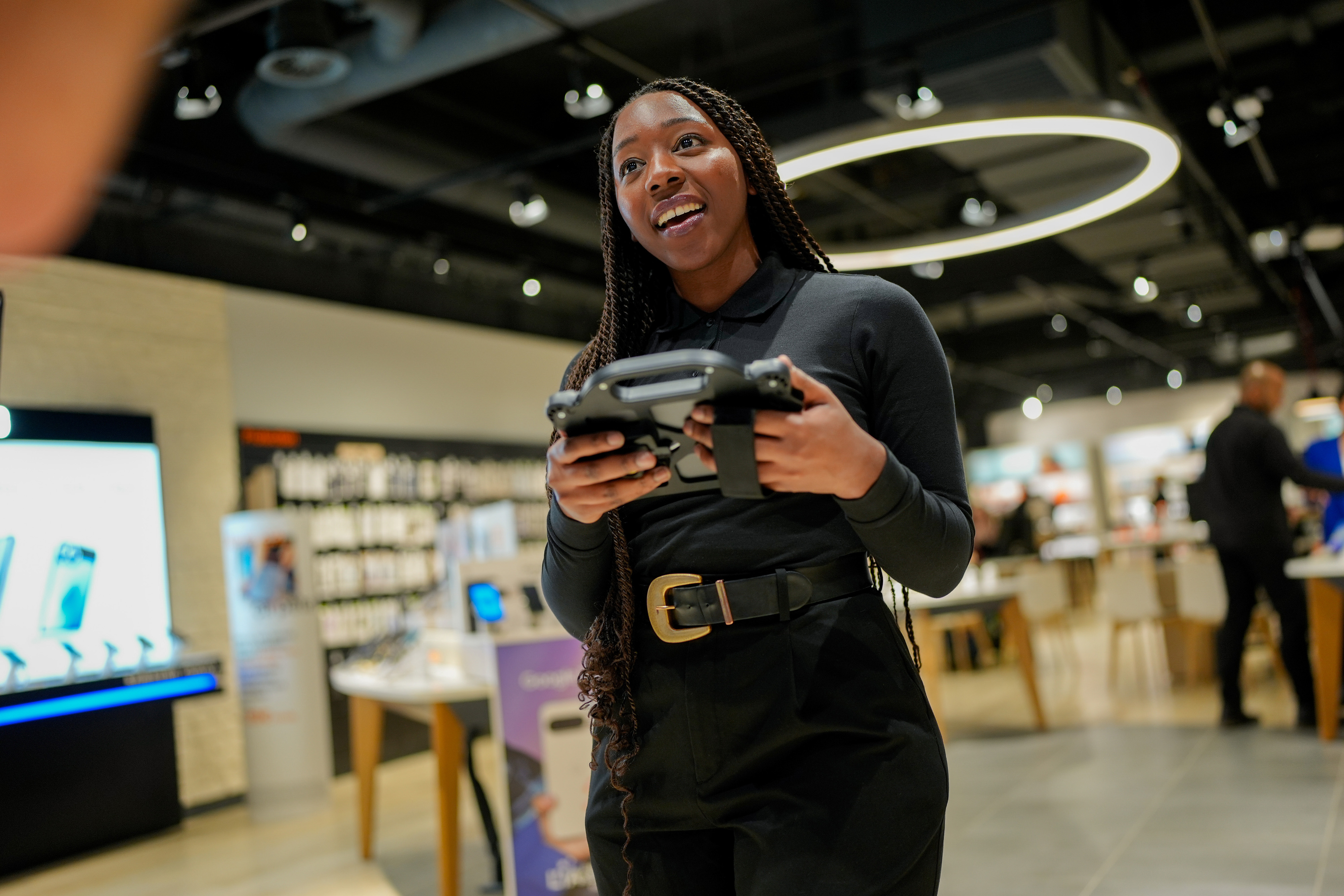 Orange advisor using tablet in store