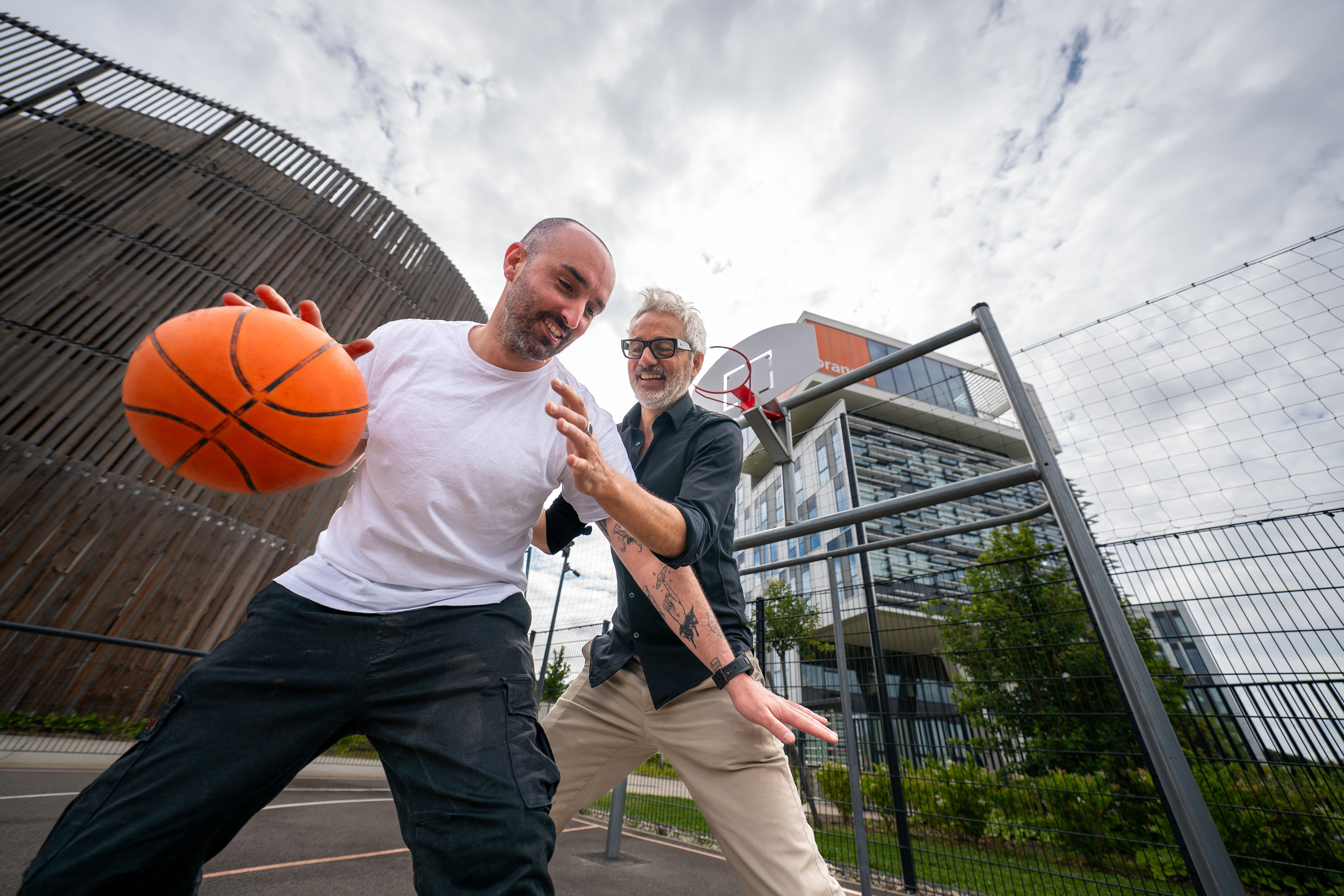 Orange employees playing basketball