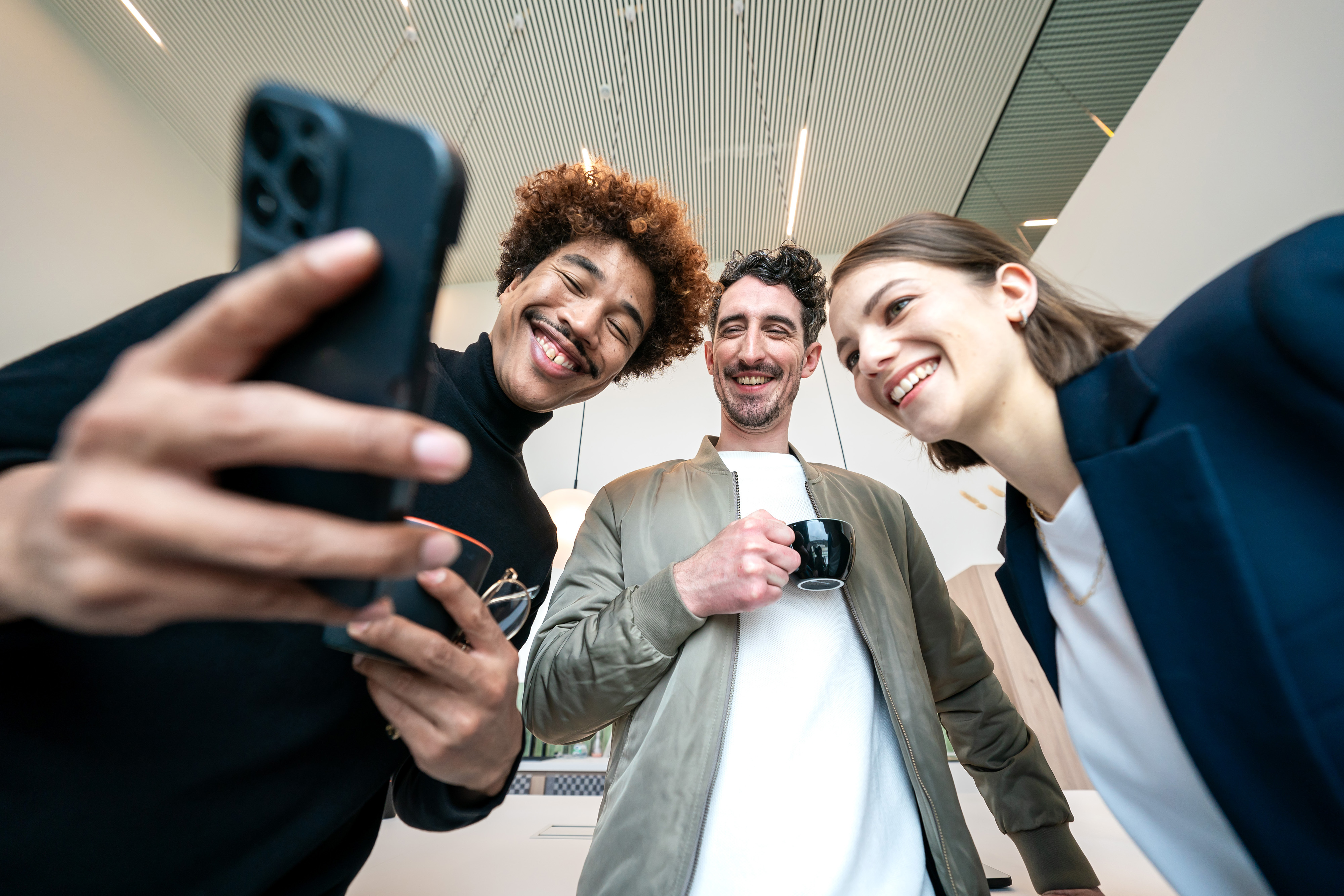 Orange team taking a photo with smartphone
