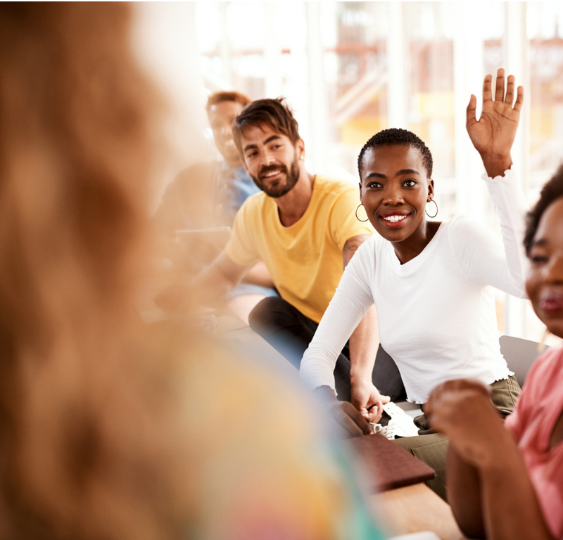 girl raising hand in class