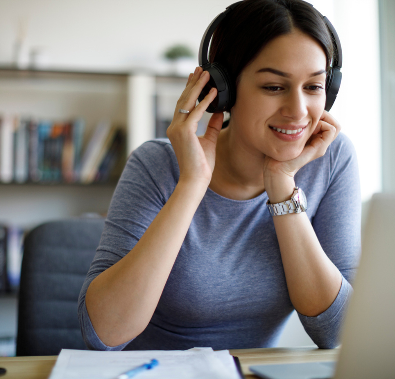 person with headphones listening