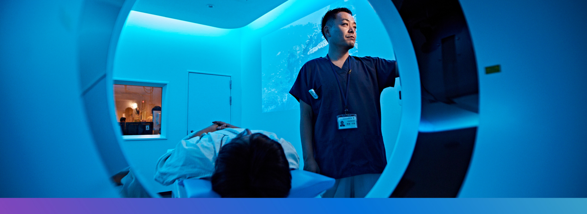 Doctor treating patient using Philips MRI Machine. Explore careers in global business services at Philips