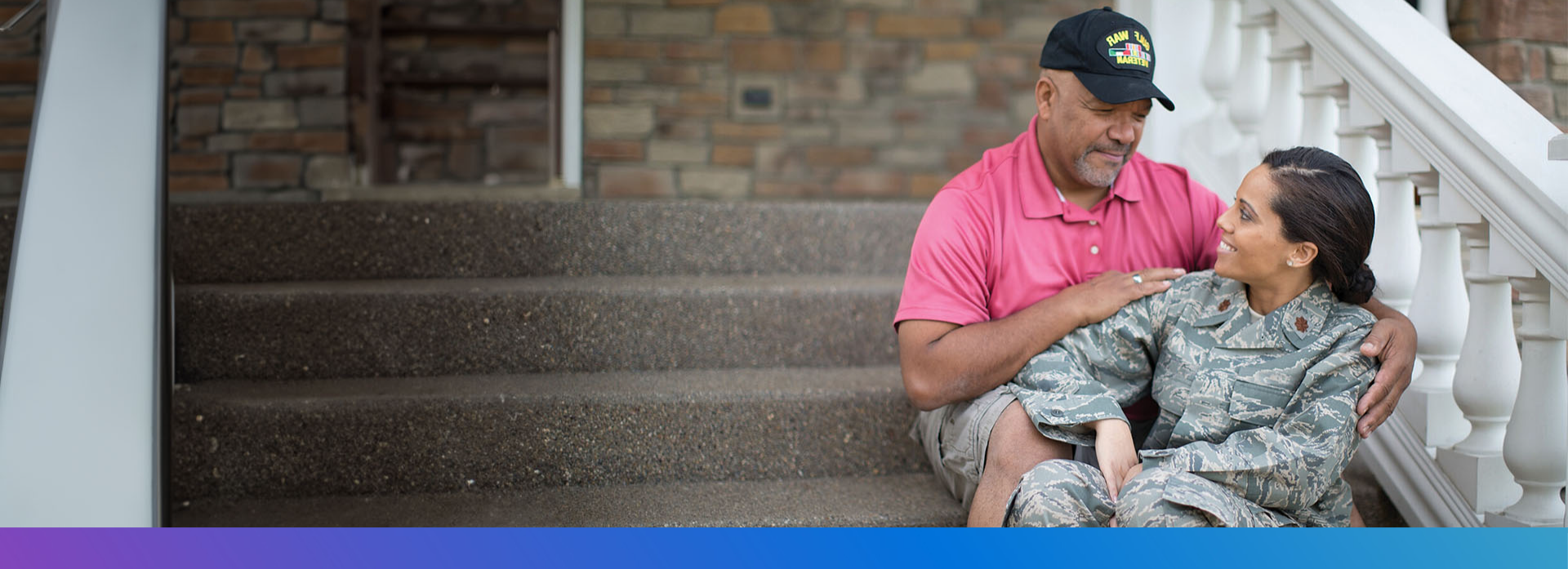 Veteran and father sitting on staircase. Discover career opportunities for Military Veterans at Philips