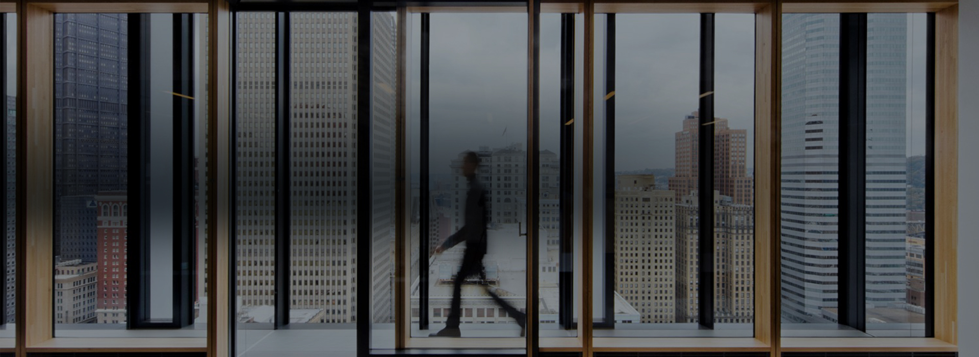 Man walking through office corridor