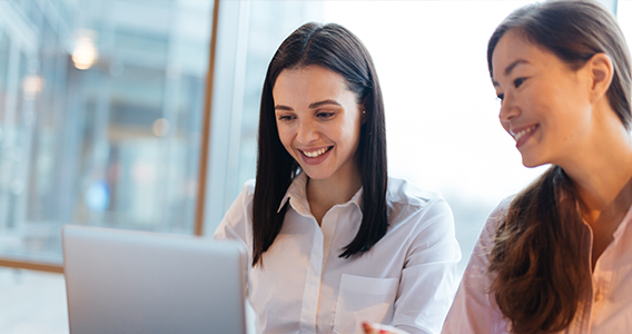 Two female students working together at a laptop