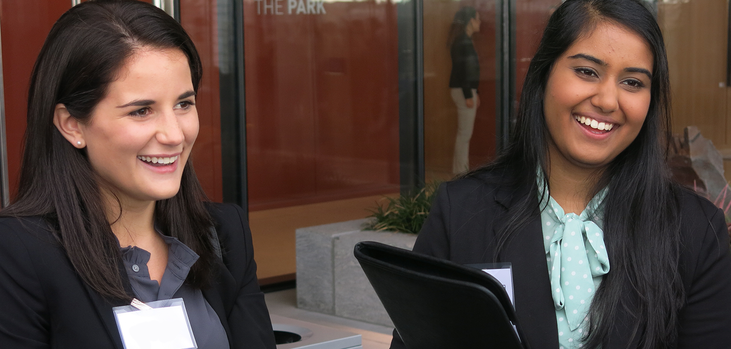 Two female students chatting during a networking event