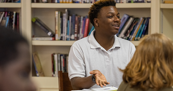 High school student participating in classroom conversation