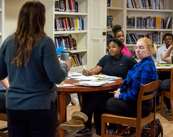 Group of students working together in a library