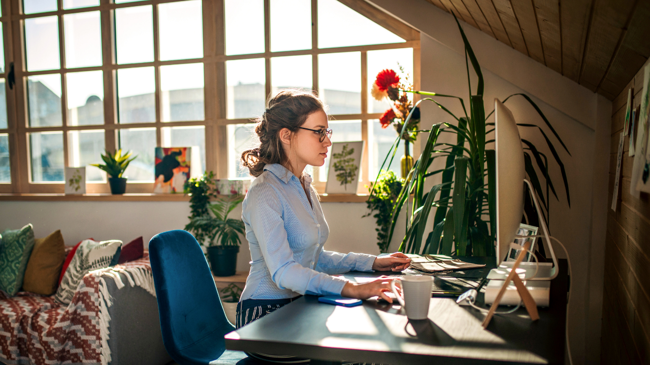 A girl sits at a computer doing an online assessment
