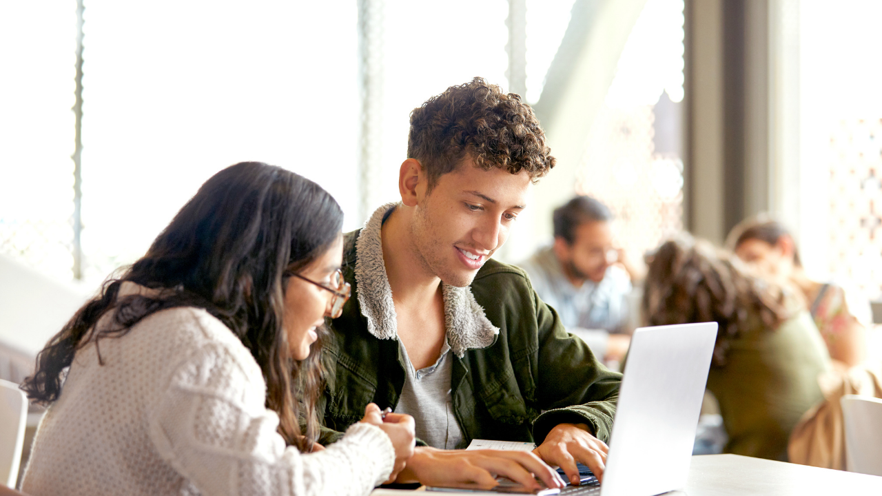 Boy and girl learn over a computer