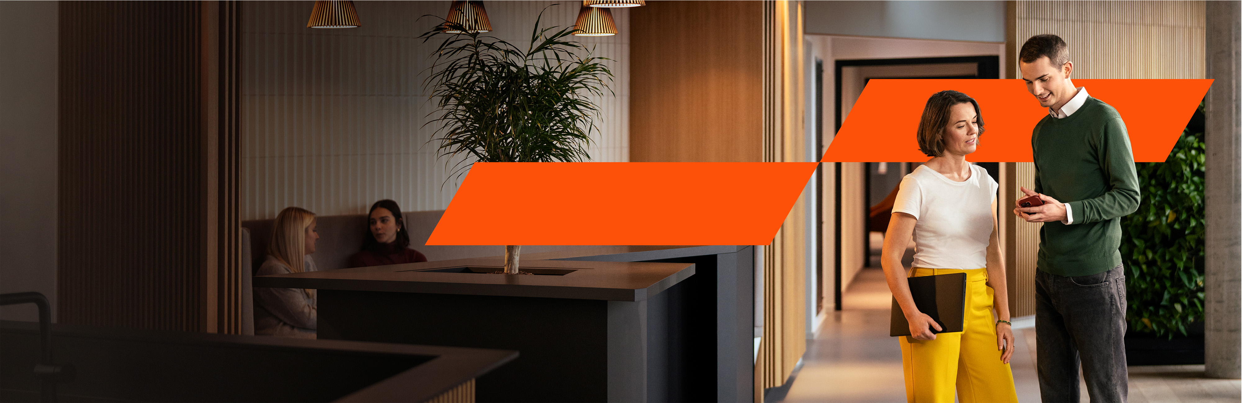 Colleagues standing in the office and talking