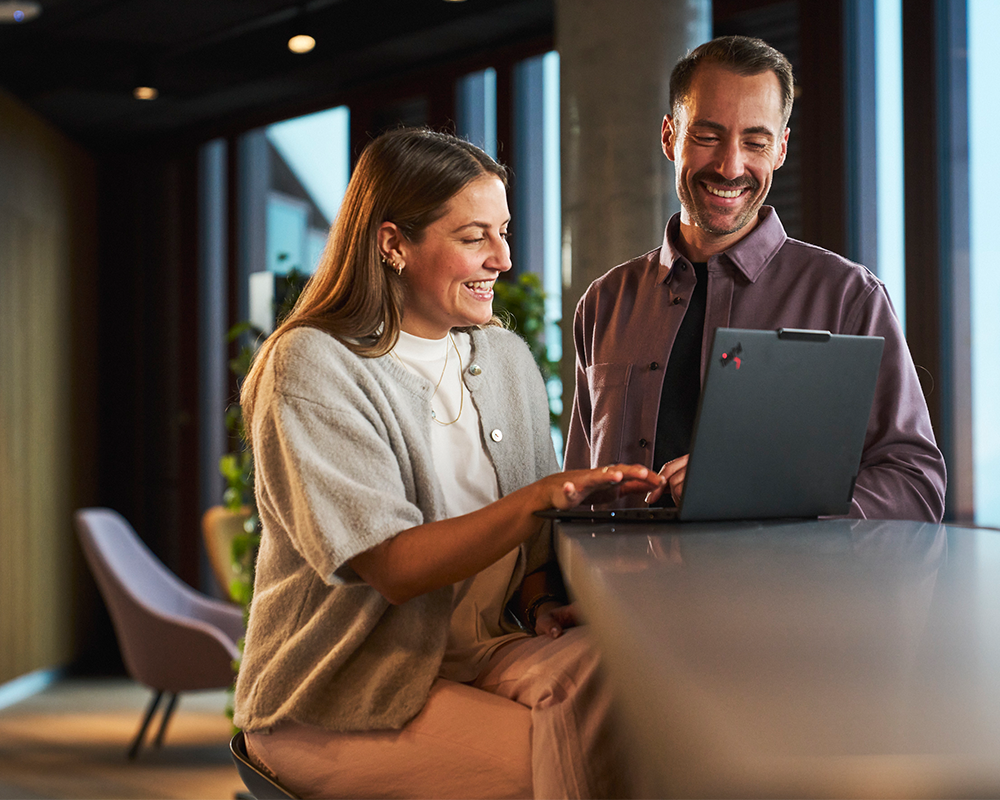 Experts discuss data on a laptop