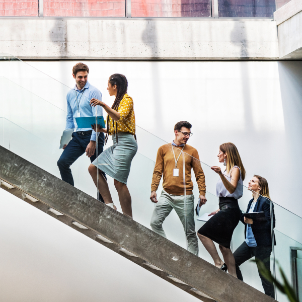 A group of businesspeople walking up the stairs
