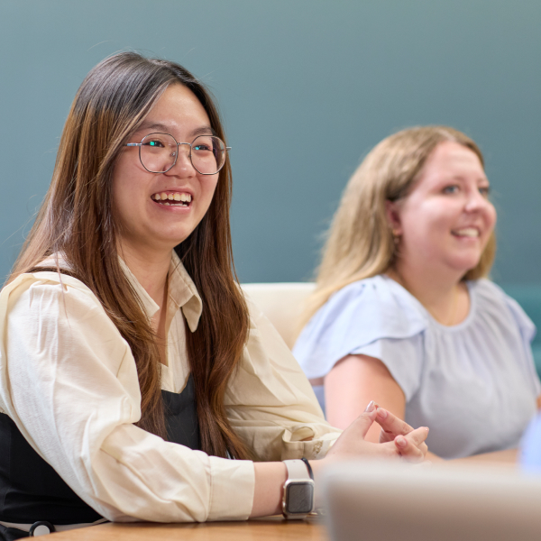 Diverse team of women smiling in a meeting