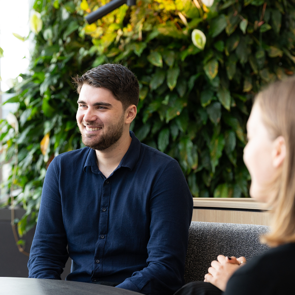 Graduate sitting at a table