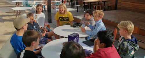Lady wearing RUOK t-shirt with kids