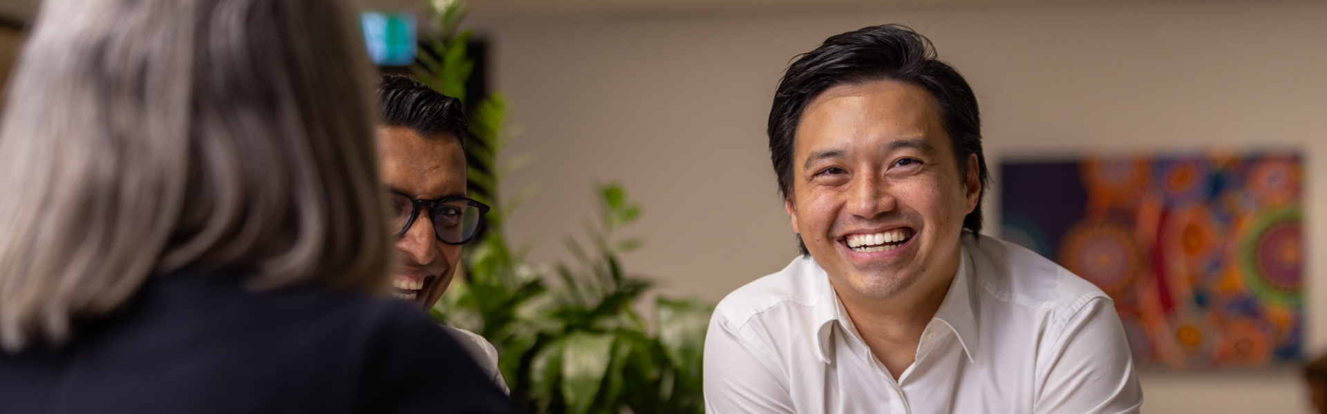 Young Asian man smiling at the camera