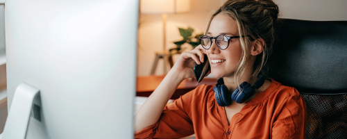 Young woman working till late at home office