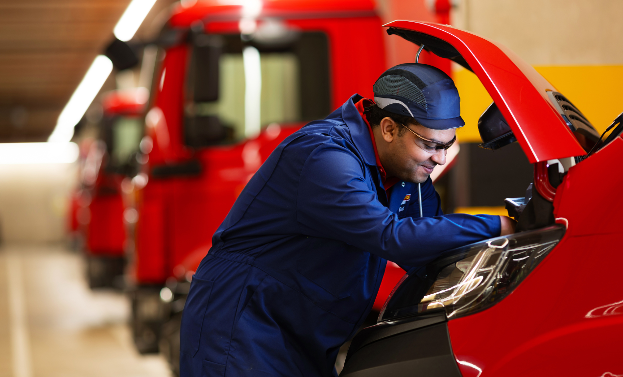 Mechanic working under on van engine
