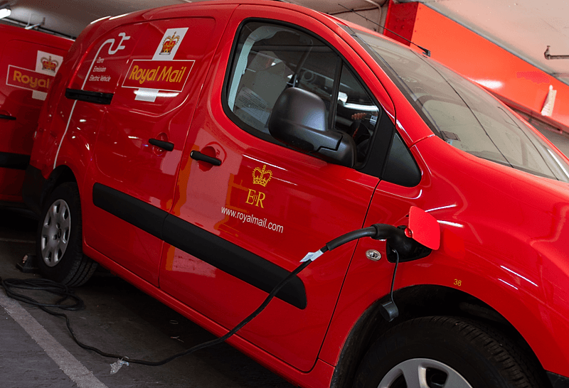Electric van connected to charger