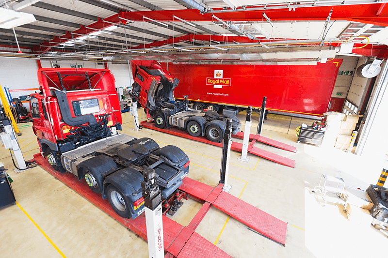 Truck and trailer in workshop bay