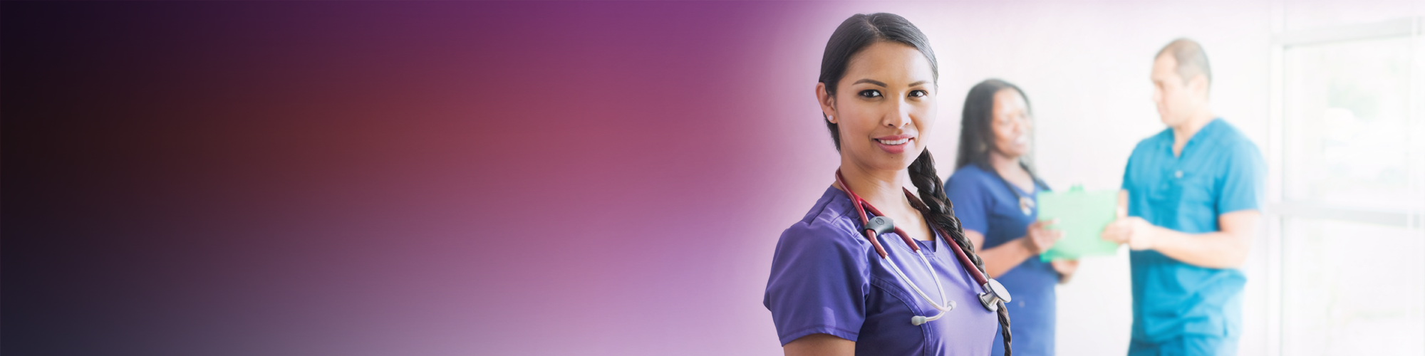Clinical professional smiling to camera with a blurred gradient background transitioning from dark to light tones