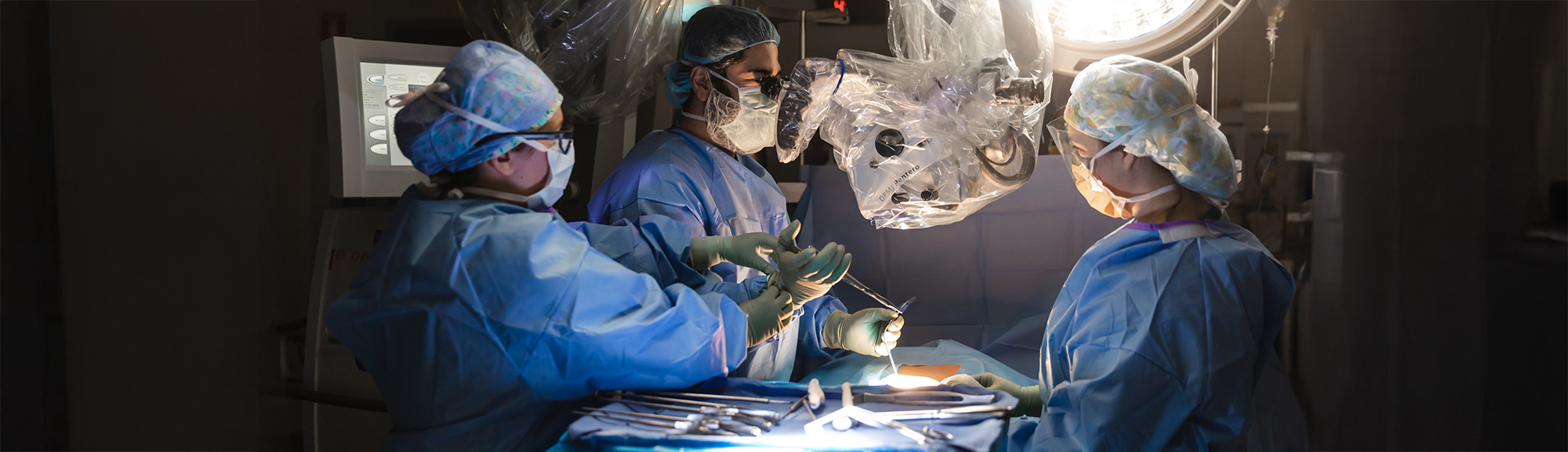A surgeon and staff in an operating room