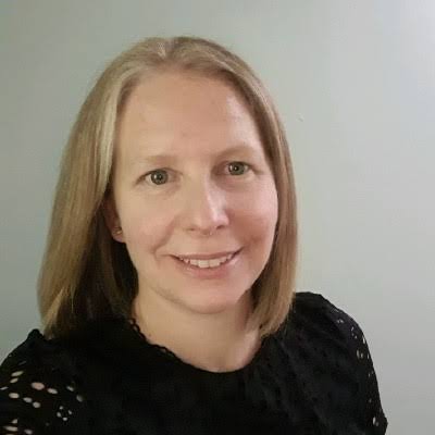 Woman in a black top smiling