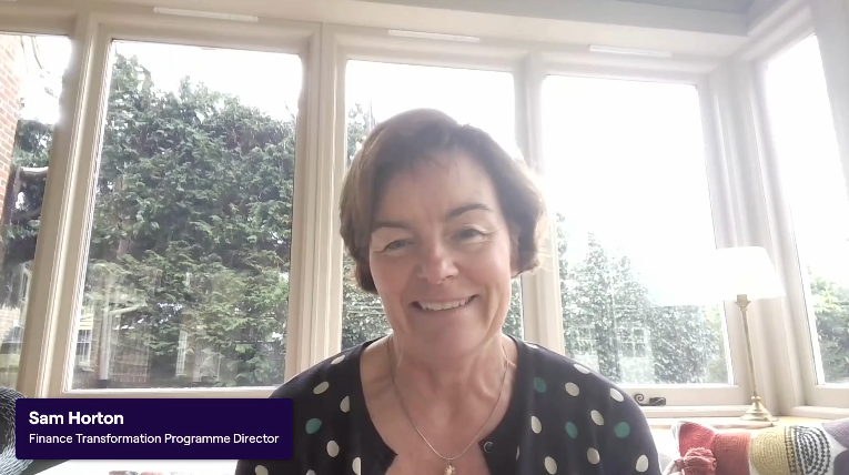 New Finance Hub - Sam Horton Video - COVER PHOTO of a woman with short brown hair, smiling