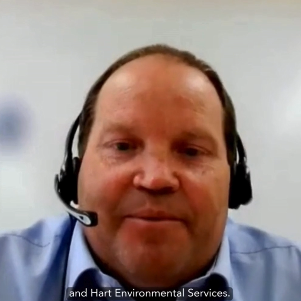 Man in blue shirt and headset