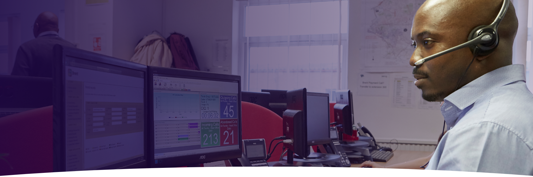 UK-CareerPaths-Header-Hero-Man-at-Desk-Headset-Computer-Career-Pathways-1800x600px