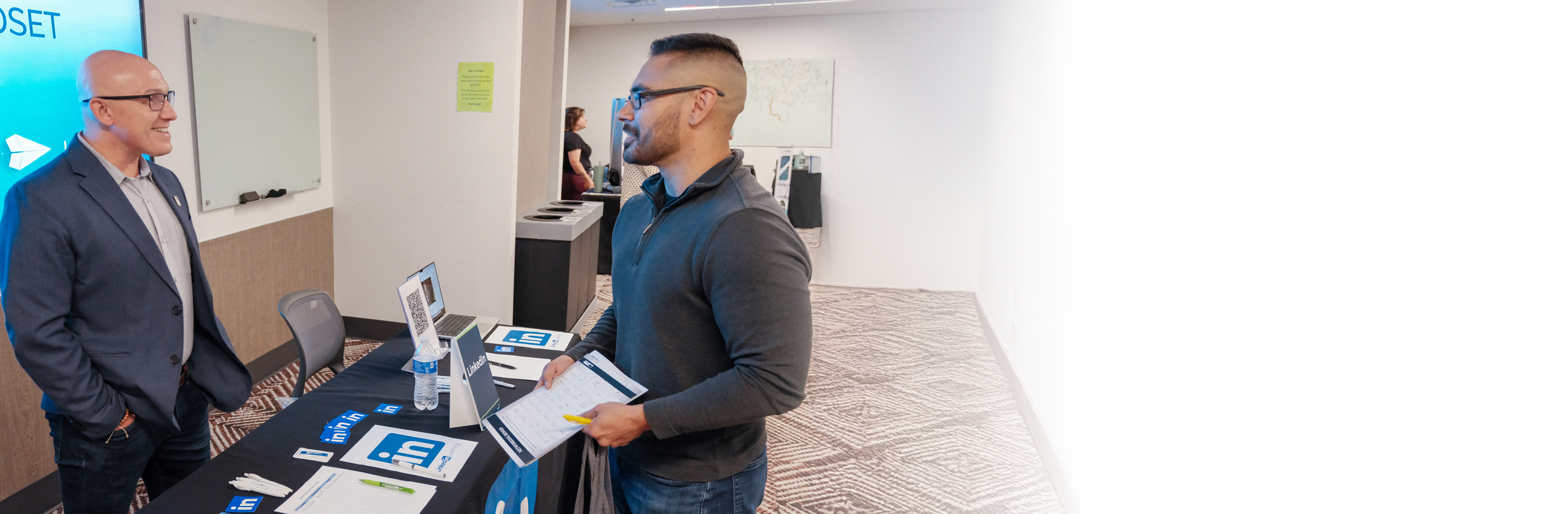 Shaw associates networking at an event.