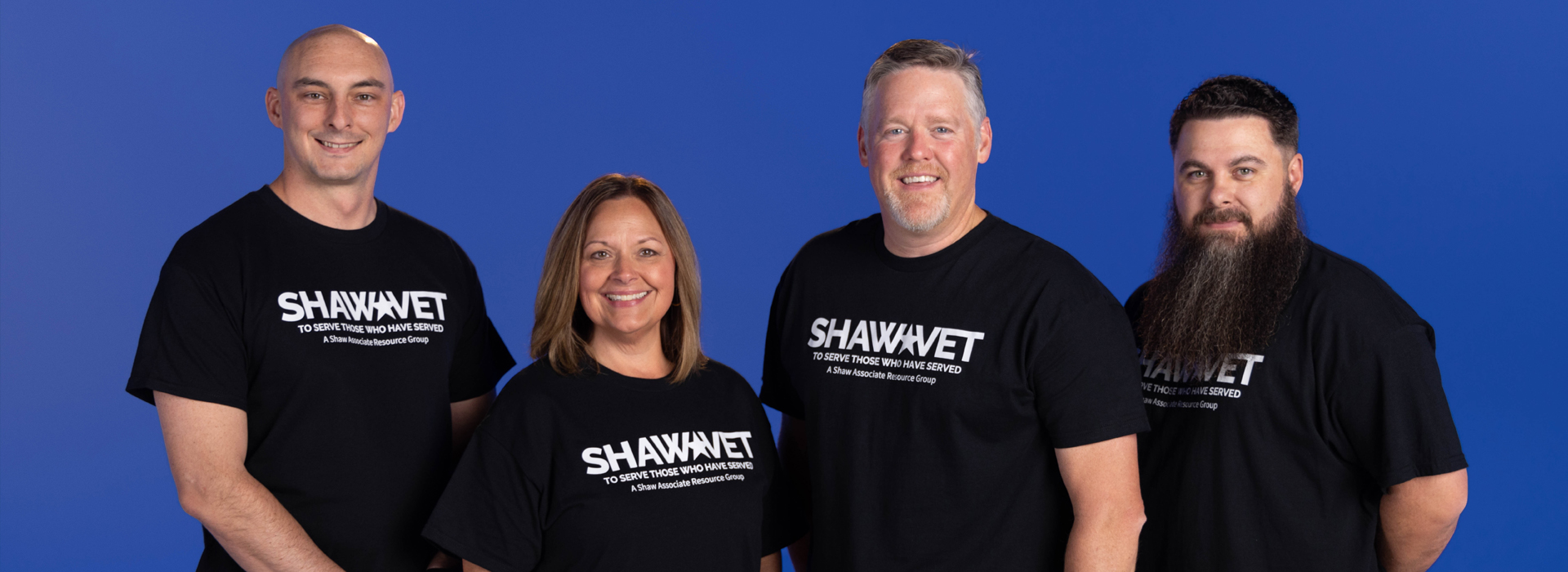 A Shaw associates smiling while on a power industrial truck.