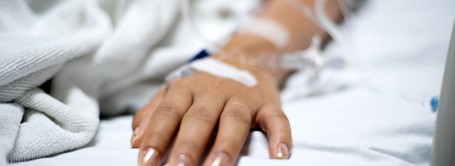 Close up of a hand of a patient getting treated with an infusion