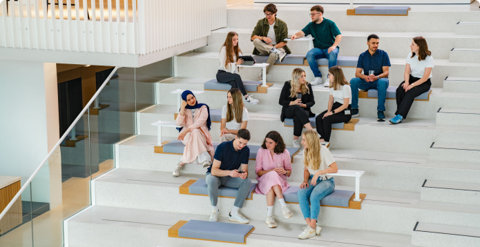 Students sitting on stairs chatting