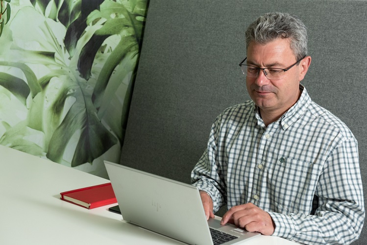 One of our colleagues working from his laptop
