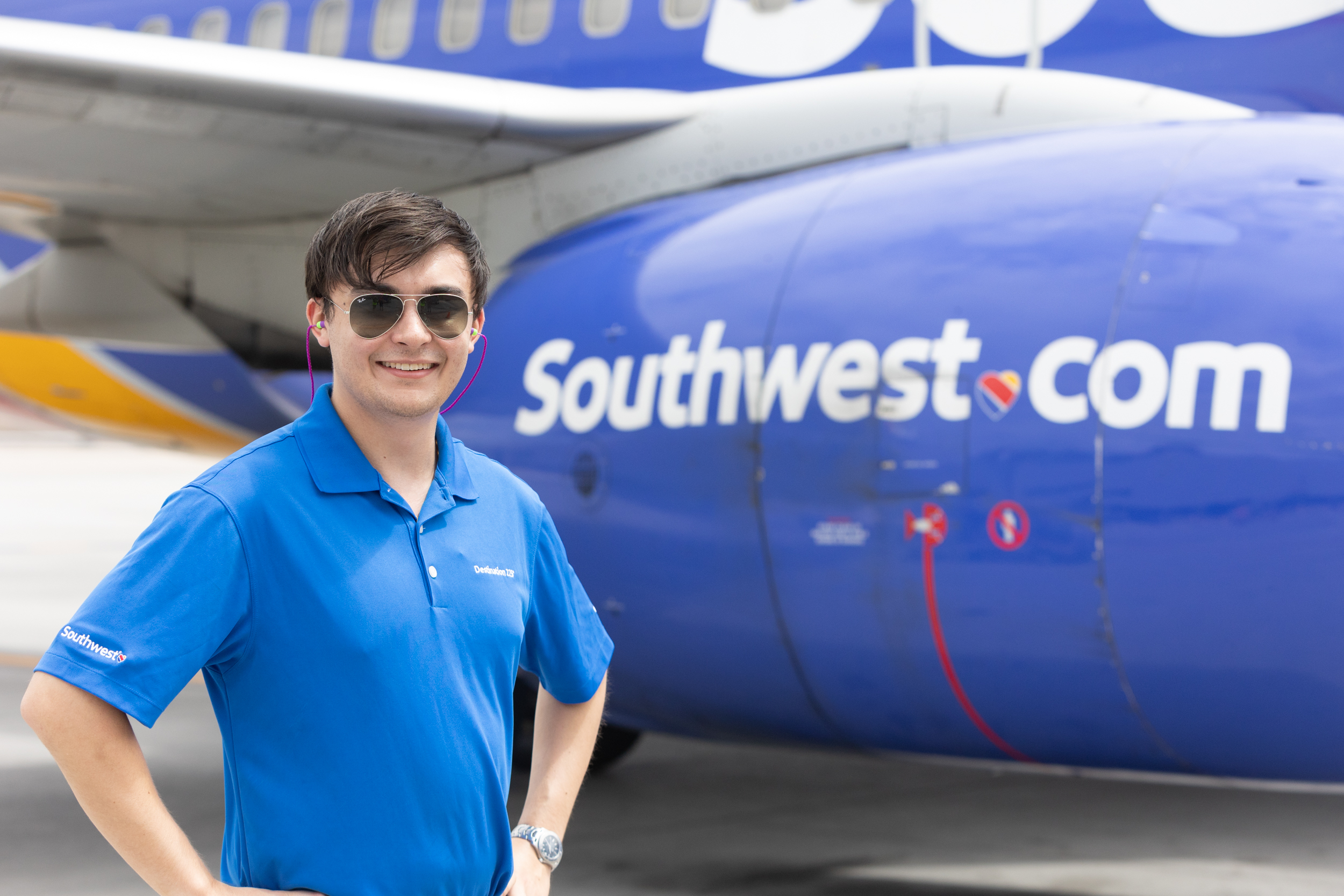 Destination 225° cadet Robbie Cheung pictured next to a Southwest plane during his first program touchpoint. 
