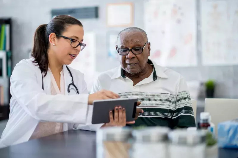 Stock_Doctor-showing-tablet-to-patient_800x533px_web.jpg