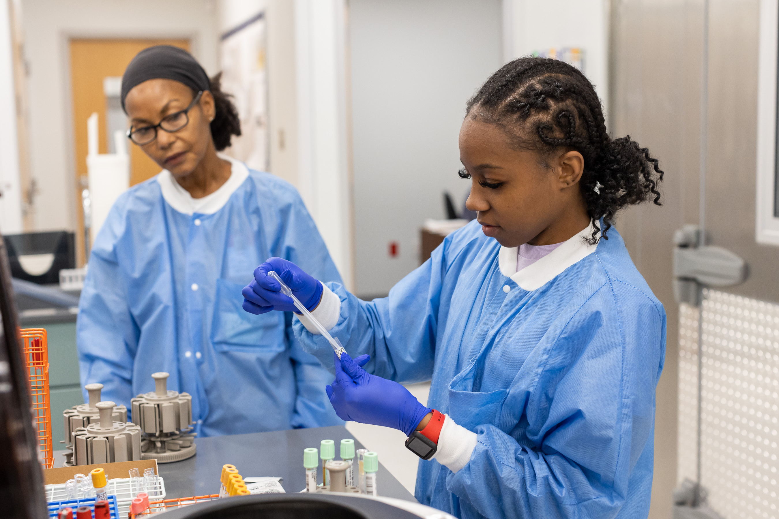 Lab Tech filling vials